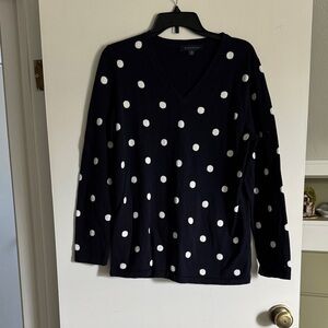 Navy blue polka dot sweater.